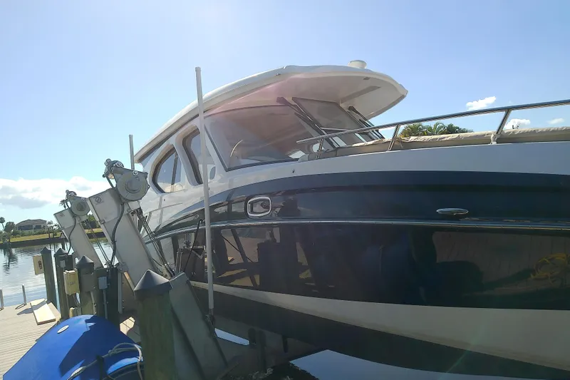 Slide: The Image of 2019 Floe Craft 3950C Aquafina boat docked under clear blue sky. - 8