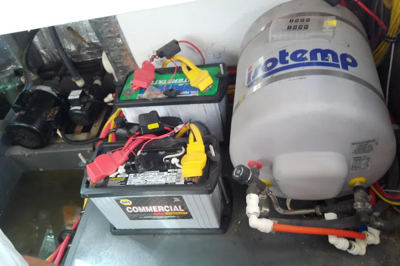 Slide: The Image of Engine compartment of 2019 Floe Craft 3950C Aquafina with batteries and water heater. - 80