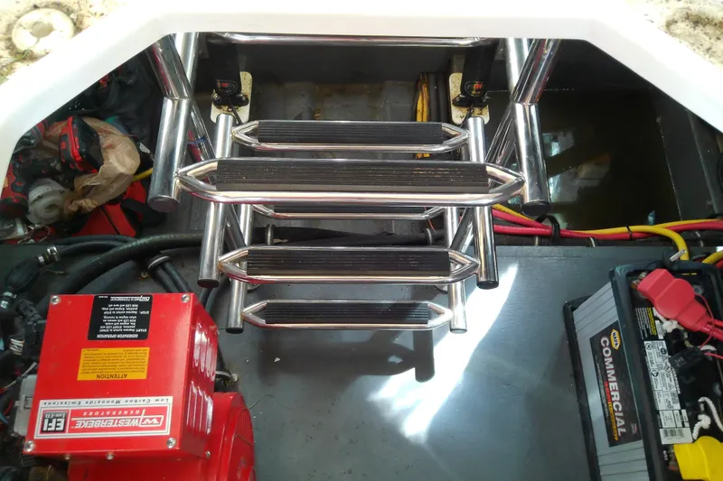 Slide: The Image of Engine compartment of 2019 Floe Craft 3950C Aquafina with metal ladder and battery. - 82
