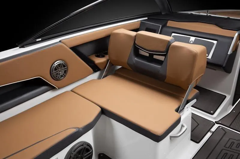 Slide: The Image of 2026 Scarab 285 LX Wake boat interior with tan and black seating, modern design. - 10