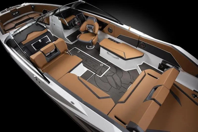 Slide: The Image of 2026 Scarab 285 LX Wake boat interior with luxurious brown and black seating. - 11