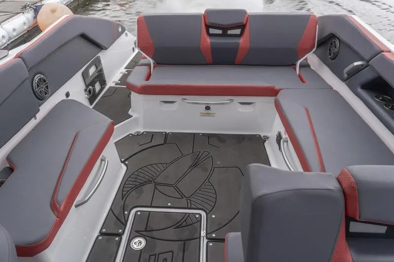 Slide: The Image of 2026 Scarab 285 LX Wake boat interior with gray and red seating, stylish design. - 20