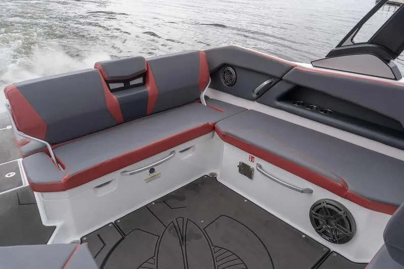 Slide: The Image of Interior of 2026 Scarab 285 LX Wake boat with gray and red seating. - 21