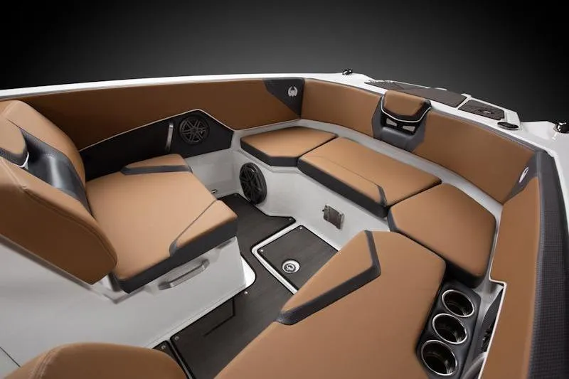 Slide: The Image of 2026 Scarab 285 LX Wake boat interior with brown seating and cup holders. - 4