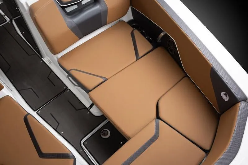 Slide: The Image of Luxurious seating in 2026 Scarab 285 LX Wake boat, featuring tan and gray upholstery. - 5