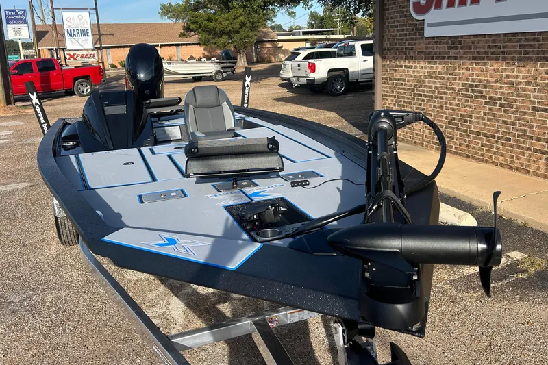 Slide: The Image of 2026 Xpress H20C Crappie boat displayed outdoors at a dealership. - 7
