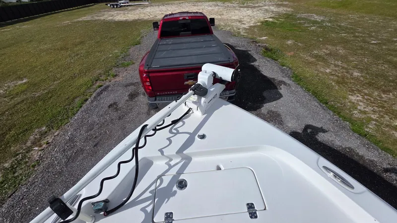 Slide: The Image of 2015 Sea Hunt BX 24 BR boat on trailer with red pickup truck. - 16