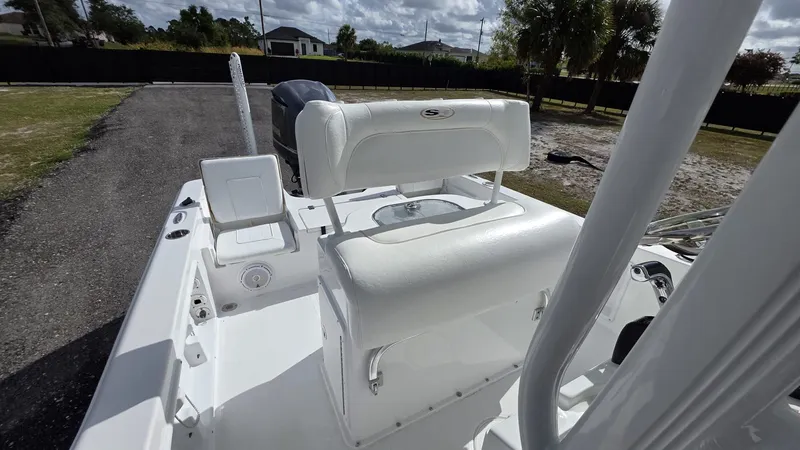 Slide: The Image of 2015 Sea Hunt BX 24 BR boat with white seating area. - 3