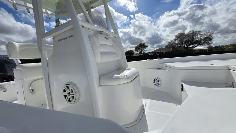 Slide: The Image of Interior view of a 2015 Sea Hunt BX 24 BR boat under cloudy skies. - 5