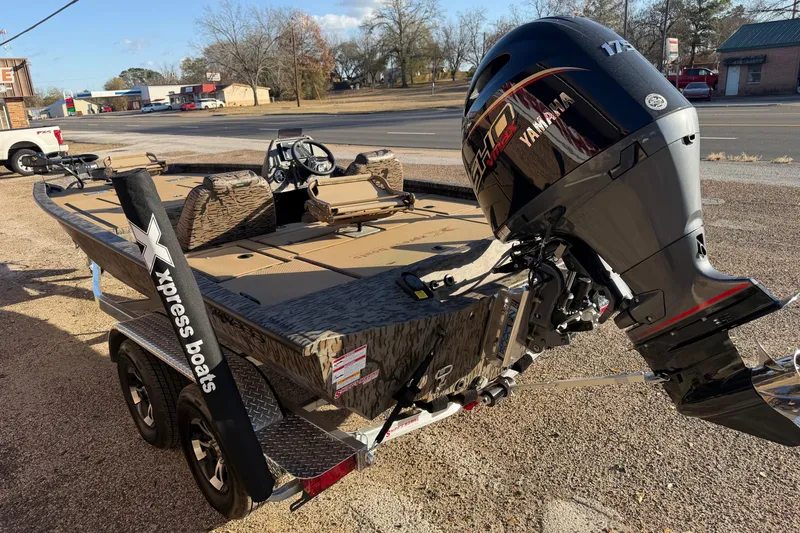 Slide: The Image of 2026 Xpress H20C Crappie boat with Yamaha engine, parked on a trailer. - 3