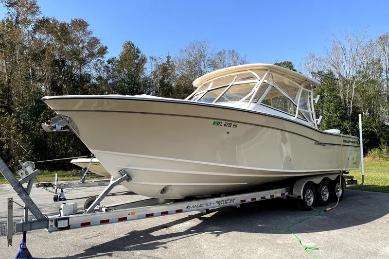 The Image of 2017 Grady-White Freedom 307 boat on trailer, parked outdoors. - 1
