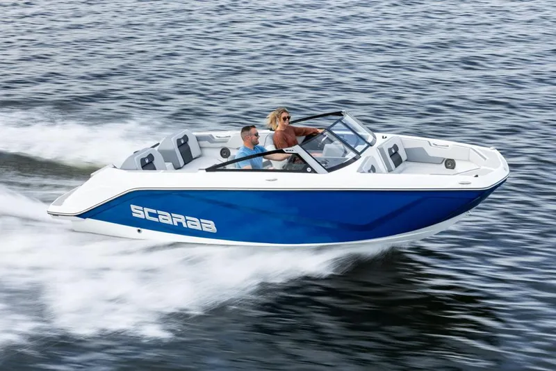The Image of Manufacturer Provided Image: 2026 Scarab 210 SE speedboat cruising on open water, featuring sleek blue and white design. - 1