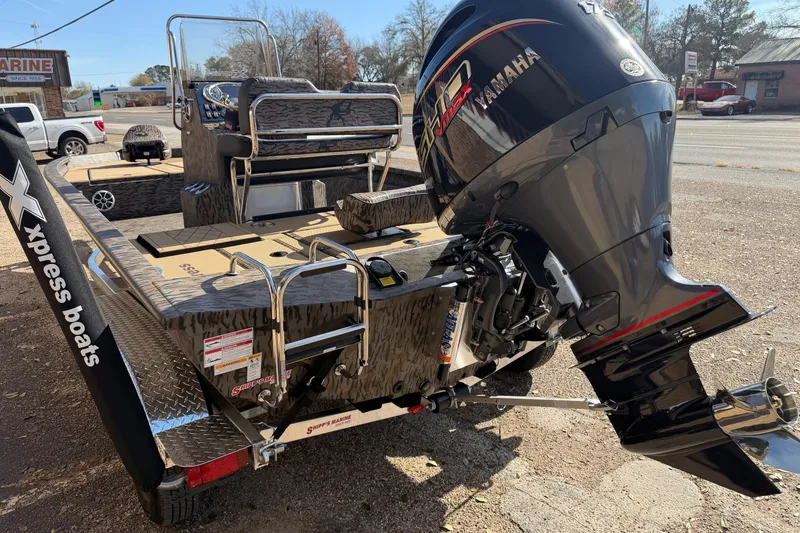 Slide: The Image of 2026 Xpress H210B Bay boat with Yamaha outboard motor on trailer. - 7