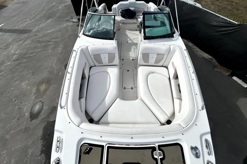 Slide: The Image of 2018 Four Winns HD240 boat with spacious white seating and sleek design. - 22