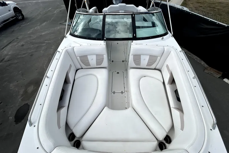 Slide: The Image of 2018 Four Winns HD240 boat with spacious white seating and sleek design. - 23