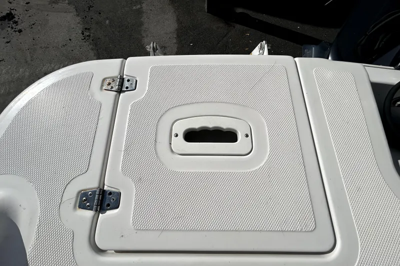 Slide: The Image of 2018 Four Winns HD240 boat deck with textured surface and hatch. - 33
