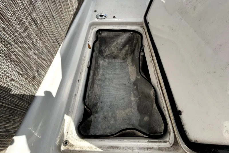 Slide: The Image of Storage compartment of a 2018 Four Winns HD240 boat, open and empty. - 40