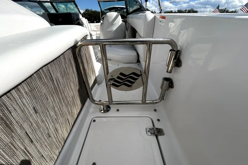 Slide: The Image of 2018 Four Winns HD240 boat interior with stainless steel gate and seating. - 41