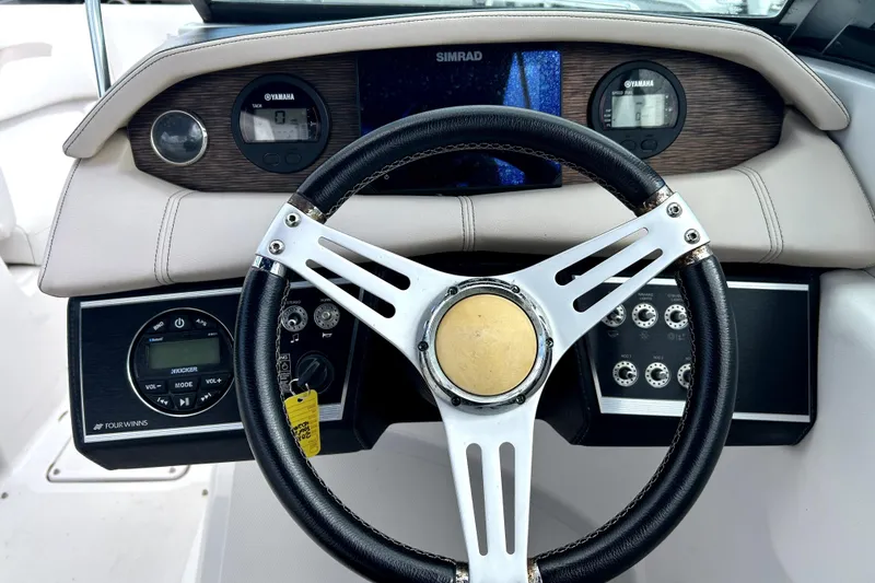 Slide: The Image of Steering wheel and dashboard of 2018 Four Winns HD240 boat with Yamaha gauges. - 64