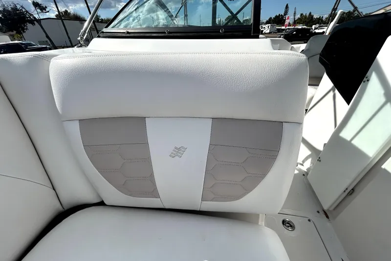 Slide: The Image of 2018 Four Winns HD240 boat interior with white and gray seating. - 85