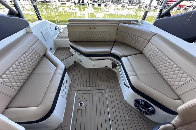 Slide: The Image of Luxurious interior of 2019 Sea Ray SLX 250 boat with plush seating and elegant design. - 11