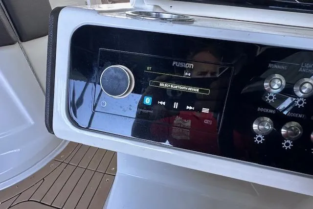 Slide: The Image of Control panel of a 2019 Sea Ray SLX 250 boat with Bluetooth audio system. - 19