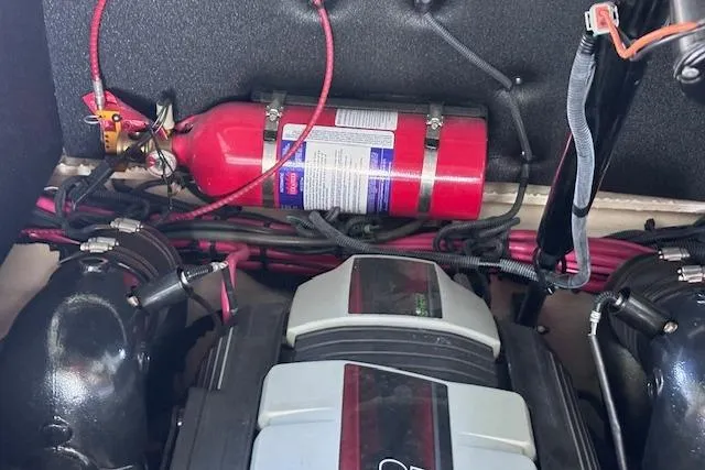 Slide: The Image of Engine compartment of a 2019 Sea Ray SLX 250 with fire extinguisher and wiring. - 25