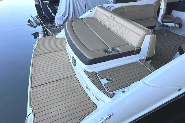 Slide: The Image of 2019 Sea Ray SLX 250 boat with spacious deck and comfortable seating. - 4