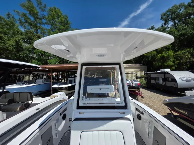 Slide: The Image of The image shows the cockpit of a 2026 Yamaha 222 FSH Sport E boat with a modern hardtop. - 11