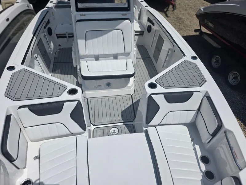 Slide: The Image of The image shows the cockpit of a 2026 Yamaha 222 FSH Sport E boat with gray and white upholstery. - 9