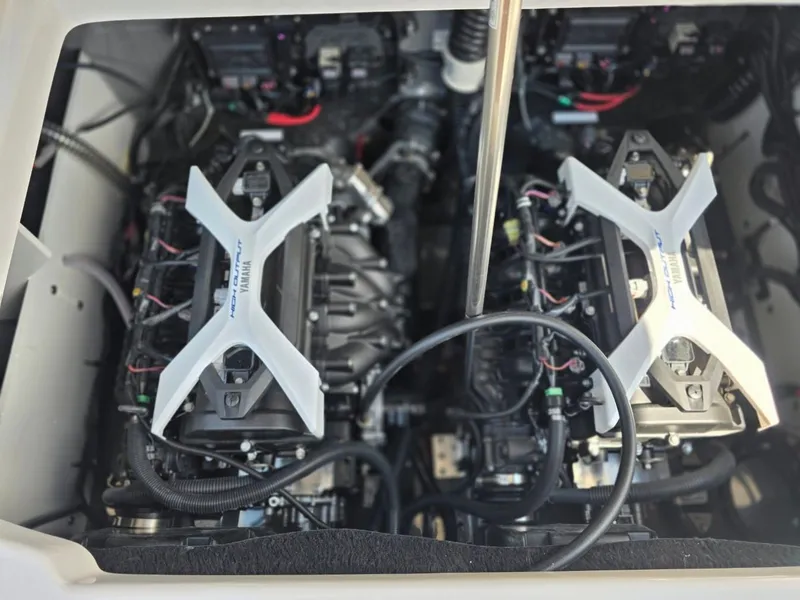 Slide: The Image of The engine compartment of a Yamaha 222 FSH Sport E with two powerful engines and wiring. - 30