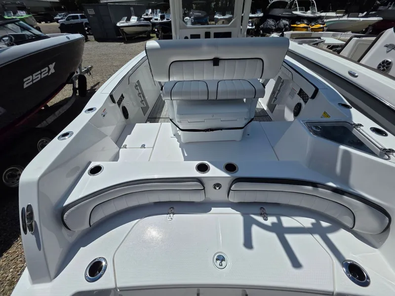 Slide: The Image of The image shows the cockpit of a 2026 Yamaha 222 FSH Sport E boat with white upholstery. - 7