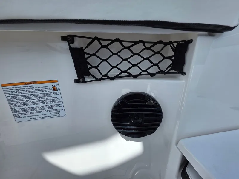 Slide: The Image of A speaker and net storage are mounted on the interior wall of a boat. - 31