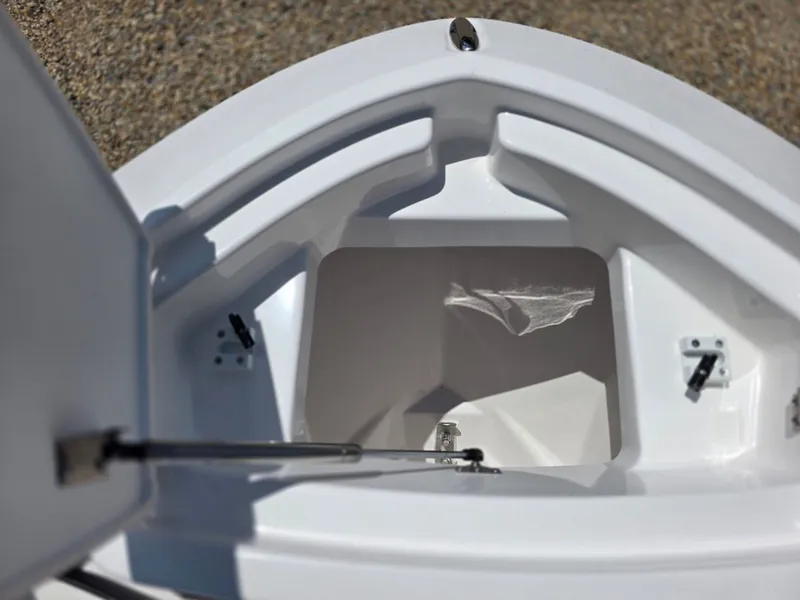 Slide: The Image of Front storage compartment of a Yamaha 222 FSH Sport E boat, open with hydraulic support. - 27