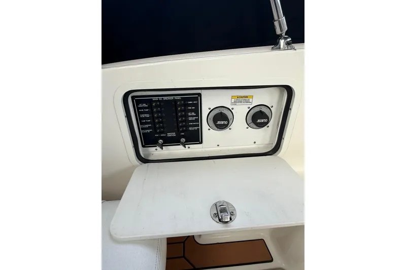 Slide: The Image of Control panel of a 2007 Sea Ray 340 boat with switches and dials. - 10