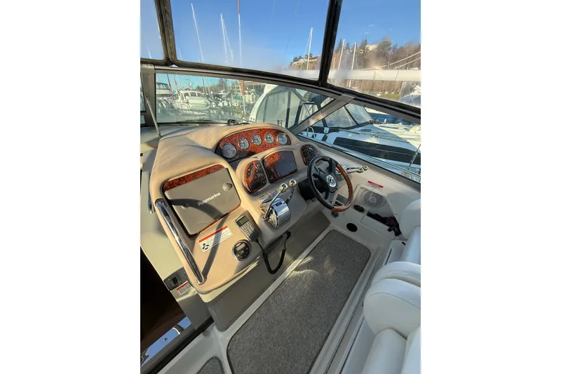 Slide: The Image of Cockpit of 2007 Sea Ray 340 boat with steering wheel and control panel. - 5