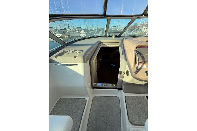 Slide: The Image of Interior view of 2007 Sea Ray 340 boat cockpit with open cabin door. - 8