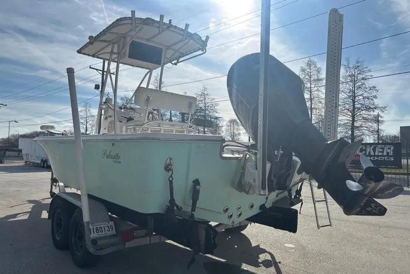 Slide: The Image of 2004 Palmetto 22 boat on trailer with outboard motor in sunny outdoor setting. - 5