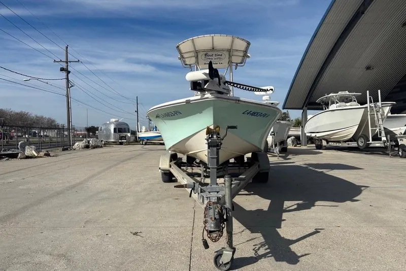 Slide: The Image of 2004 Palmetto 22 boat on trailer in marina storage area. - 8