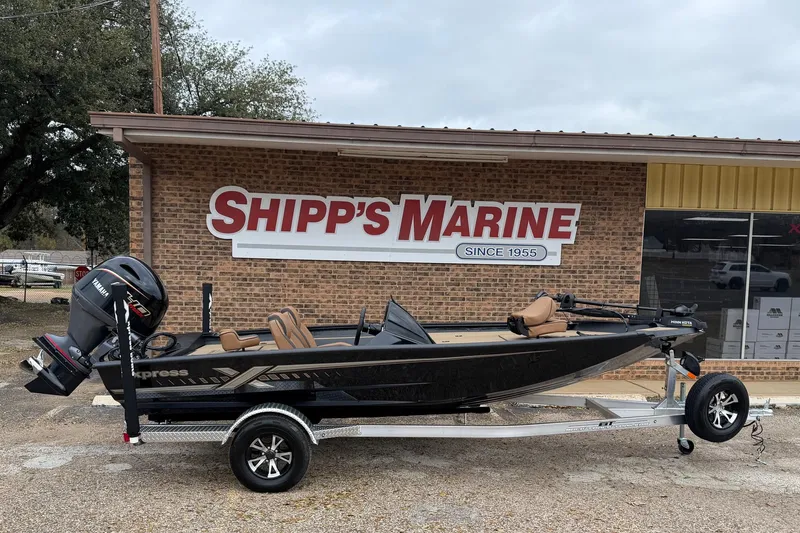 The Image of 2026 Xpress H18 boat on trailer outside Shipp's Marine store. - 1