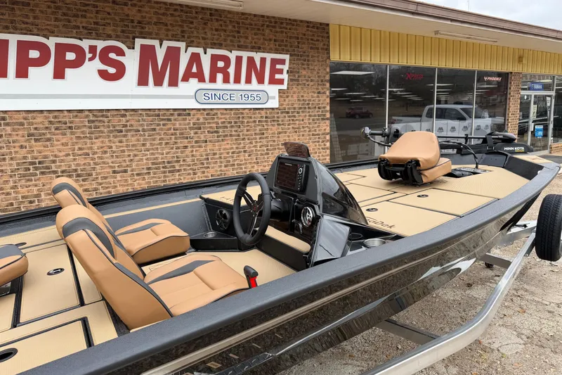 Slide: The Image of 2026 Xpress H18 boat with tan seats at Tipp's Marine dealership. - 3