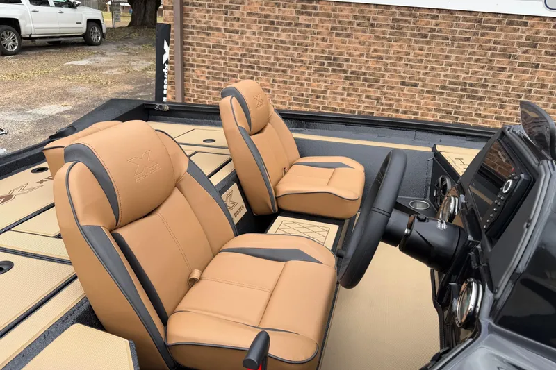 Slide: The Image of 2026 Xpress H18 boat interior with tan leather seats and modern dashboard. - 4