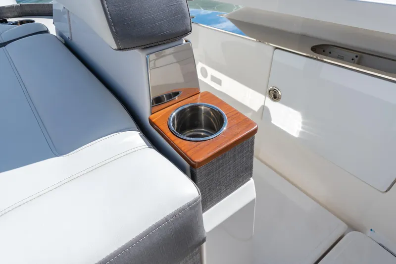 Slide: The Image of 2020 Tiara Sport 38 LS boat interior with cup holder and seating detail. - 20