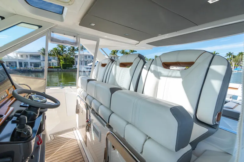 Slide: The Image of Interior of 2020 Tiara Sport 38 LS boat with luxurious seating and steering area. - 21