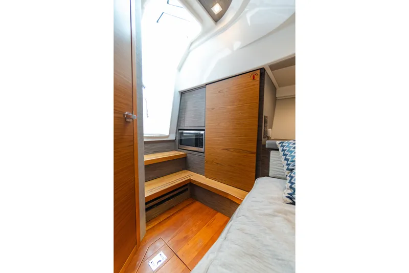 Slide: The Image of 2020 Tiara Sport 38 LS interior with wood finishes and modern design. - 28