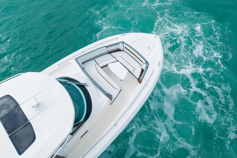 Slide: The Image of Aerial view of 2020 Tiara Sport 38 LS yacht cruising in turquoise waters. - 30