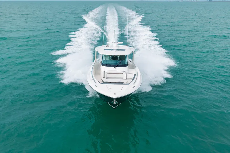 Slide: The Image of 2020 Tiara Sport 38 LS cruising on open turquoise waters. - 9