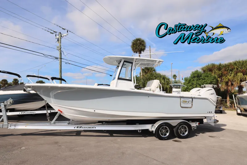 The Image of 2026 Sea Hunt Ultra 265 SE boat on trailer at Castaway Marine dealership. - 0