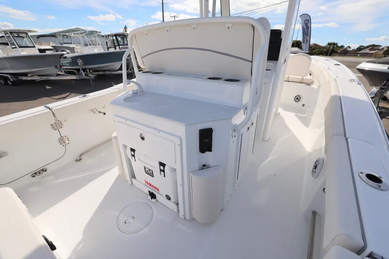 Slide: The Image of 2026 Sea Hunt Ultra 265 SE boat interior with seating and storage. - 12