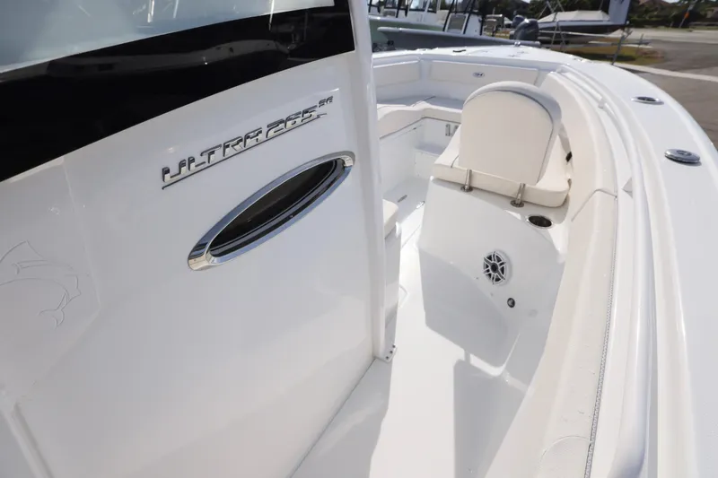 Slide: The Image of 2026 Sea Hunt Ultra 265 SE boat interior with seating and speaker detail. - 14